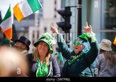 Montreal, Canada - March 17 2024： People celebrating the Saint Patrick`s Day Parade in Montreal downtown Stock Photo